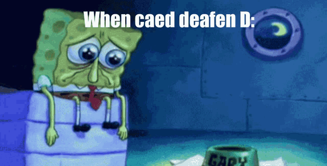 a cartoon of spongebob sitting on a box with the caption when caed deafen d