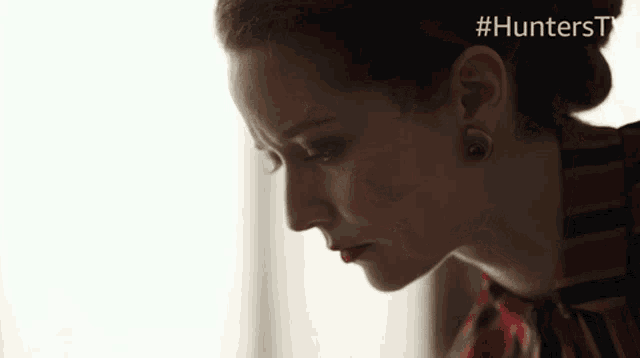 a close up of a woman 's face with the hashtag #hunterstv above her