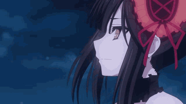 a close up of a girl with a red ribbon around her head