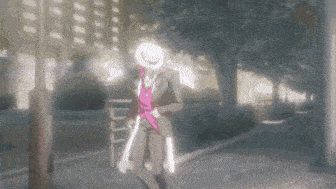 a man in a suit and hat is walking down the street .