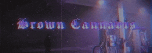 a person standing in front of a sign that reads brown cannabis
