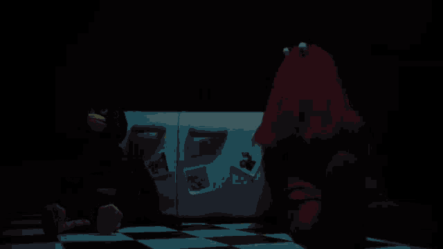 two stuffed animals are sitting in front of a refrigerator with a picture of elmo on it