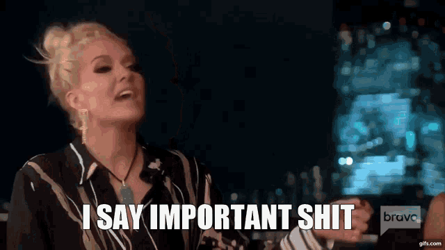 a woman says " i say important shit " in front of a city skyline