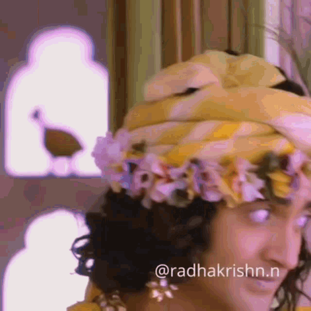 a person wearing a turban with flowers on it .