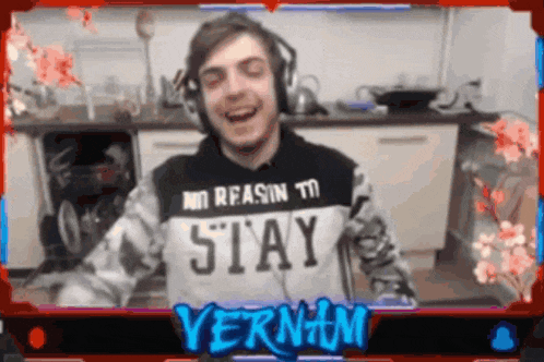 a man wearing headphones and a shirt that says " stay "