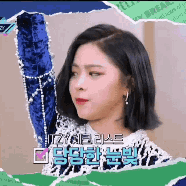 a woman in a blue and white dress with the word itzy on the bottom