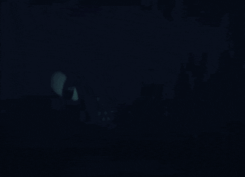 a close up of a person 's eyes in the dark