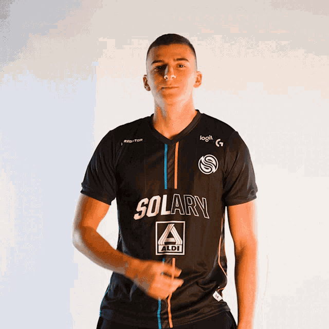 a man wearing a black shirt with solary on it