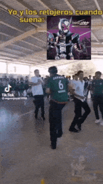 a group of people are dancing under a sign that says yo y los relojeros cuando suena