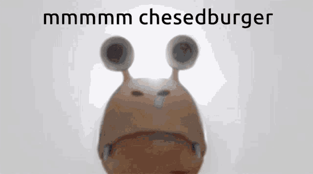 a cartoon character says mmmm cheeseburger on the bottom