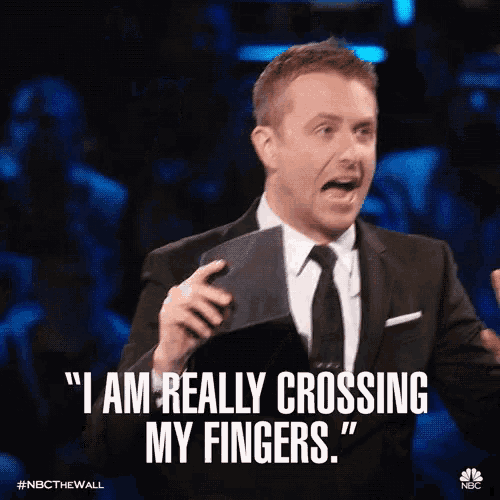a man in a suit and tie says " i am really crossing my fingers . "