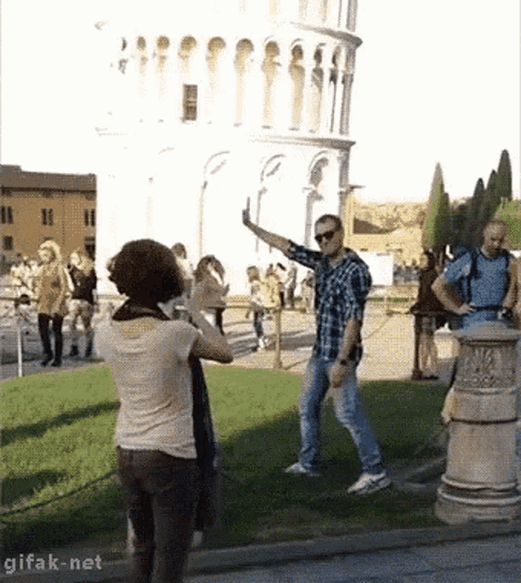 Taking Picture Leaning Tower GIF - Taking Picture Leaning Tower Knock Out GIFs
