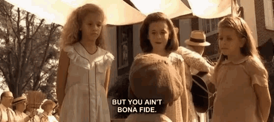 three little girls are standing next to each other and one of them is saying but you ain t bona fide .