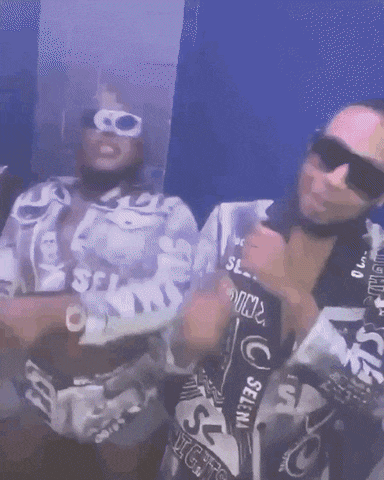 two men wearing sunglasses and shirts that say sell on them
