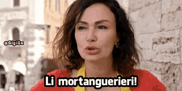 a woman in a red shirt says " li mortanguerari "