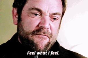 a man with a beard has the words feel what i feel on his face