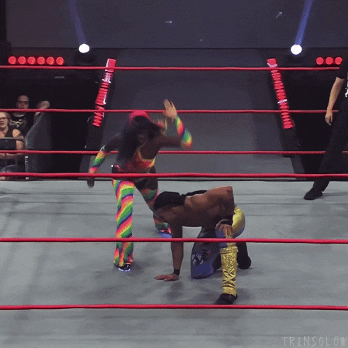 two wrestlers in a ring with a watermark that says ' tringlow '