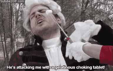 a man with a marshmallow on his face is being attacked by a woman .