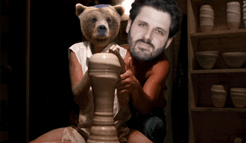 a man with a beard and a bear head is making a vase