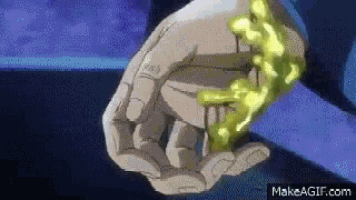 a close up of a person 's hand holding a glowing object .