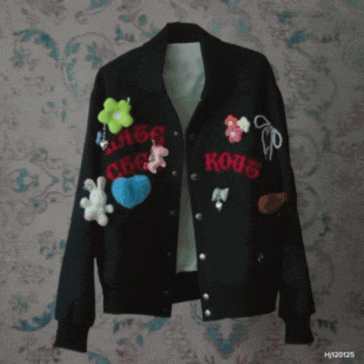 a black jacket with the word kous embroidered on the front