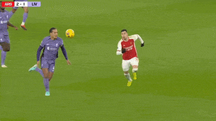 a soccer game is being played and the score is 2 to 1