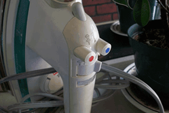 a close up of an iron with a red and blue knob