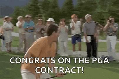 a man is holding a golf club on a golf course while a group of people watch .