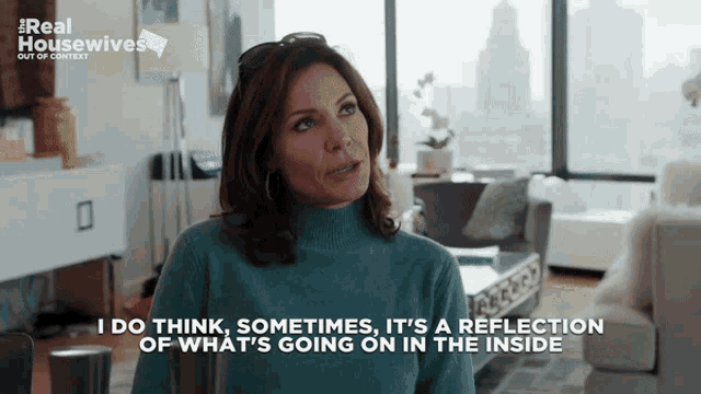 a woman in a blue sweater says i do think sometimes it 's a reflection of what 's going on inside