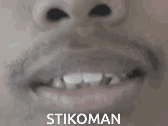 a close up of a person 's mouth with the word stikoman on the bottom right