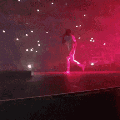 a blurry picture of a red background with a lot of lights on it