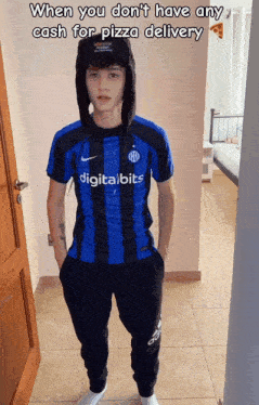 a boy wearing a blue and black striped shirt that says digitalbits on it