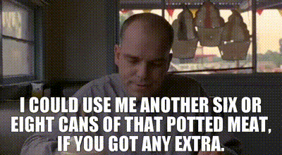 a bald man is sitting in a diner looking at his phone and says i could use me another six or light cans