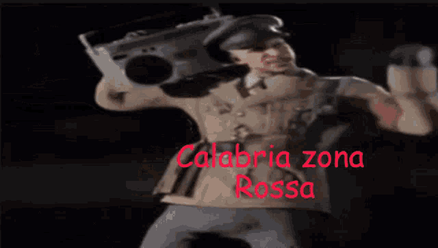 a man is holding a boombox over his head and the words calabria zona rossa are on the bottom