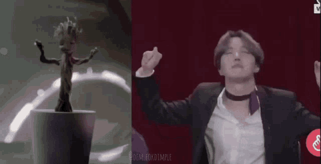 a man in a suit is dancing next to a statue of groot in a pot