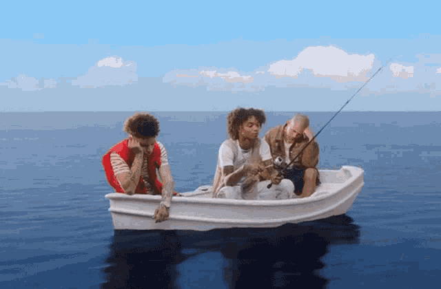 three people in a small white boat fishing