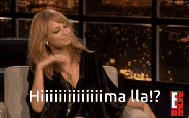 a woman sitting on a couch with the words hiiiiiiima lla written on the screen