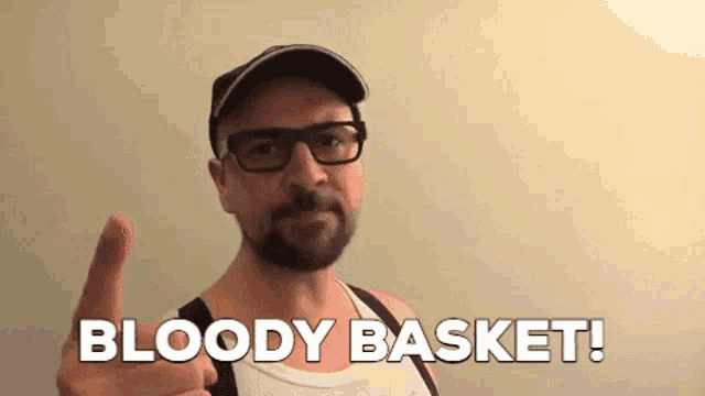 a man with glasses and a beard giving a thumbs up with the words bloody basket below him