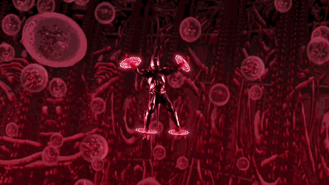 a silhouette of a man standing in a circle of red bubbles
