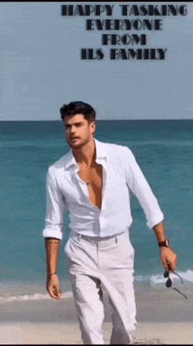 a man in a white shirt is walking on a beach with the words happy tasking everyone from his family