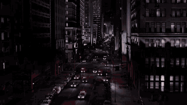 a busy city street at night with a sign that says ' a ' on it