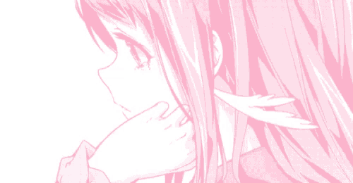 a close up of a girl 's face with pink hair