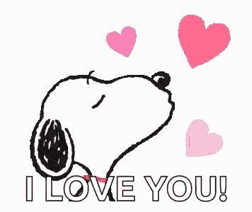 snoopy is holding a heart in his mouth and saying `` i love you '' .