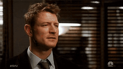 a close up of a man 's face with #svu written on the bottom