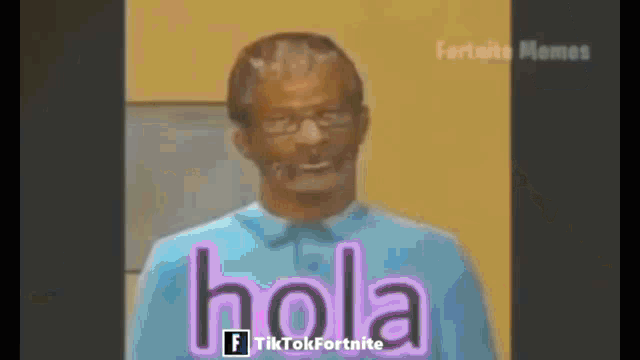 a man in a blue shirt with the word hola on his shirt