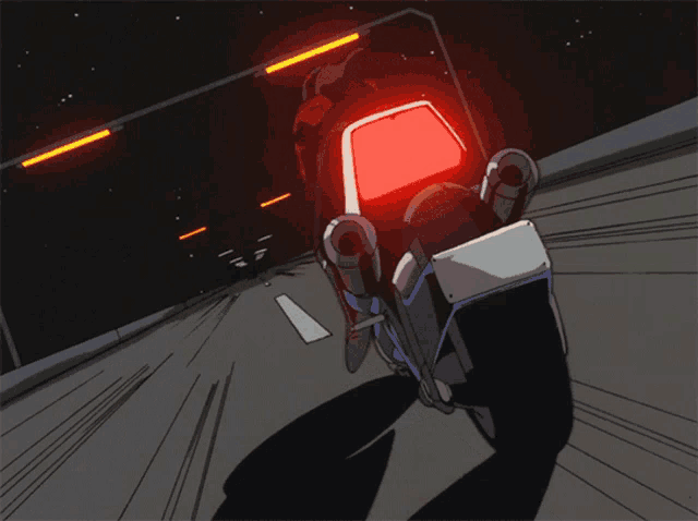 a person is riding a motorcycle with a red tail light