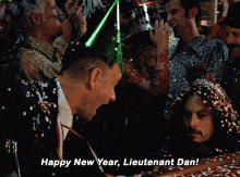 a man in a party hat says " happy new year lieutenant dan ! "