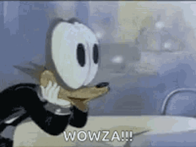 a cartoon character is sitting at a table with the words wowza written on the screen .