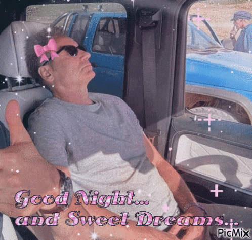 a man in a car giving a thumbs up with the words good night and sweet dreams in the background