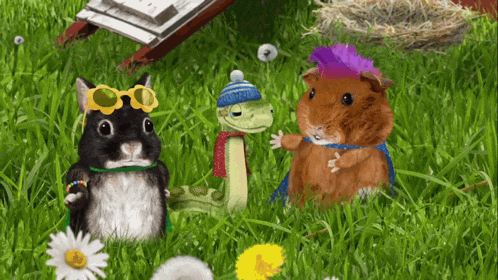 a snake a rabbit and a guinea pig are standing in a grassy field